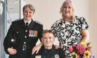 Station Commander Karla Stevenson with Craig and Caren Christie at their wedding. Image: Scottish Fire and Rescue Service.