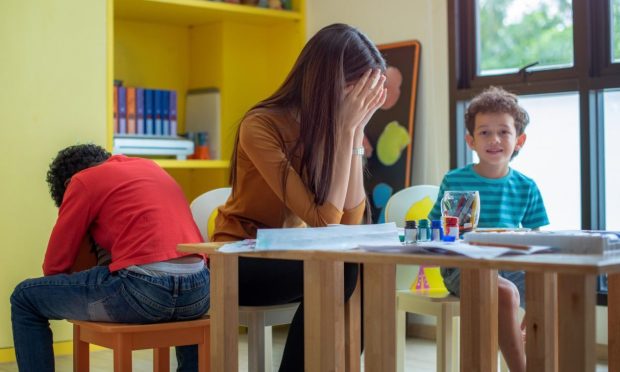 Teacher and children.