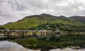 The A87 road bridge above Loch Long in Dornie town in Scotland near the famous Eilean Donan Castle;