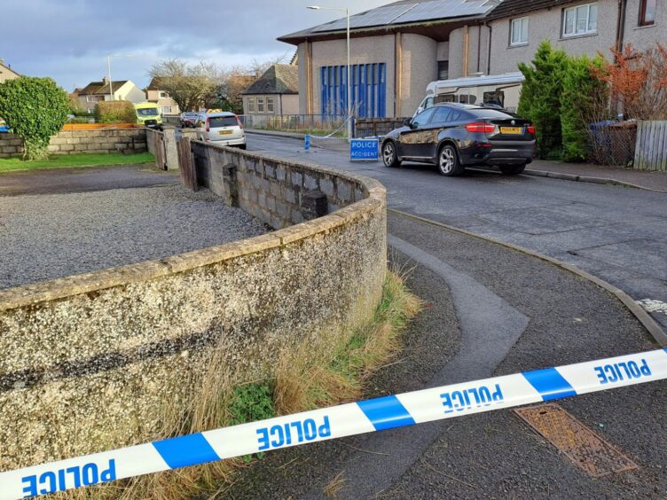 Druid Road taped off as police remain at the scene.