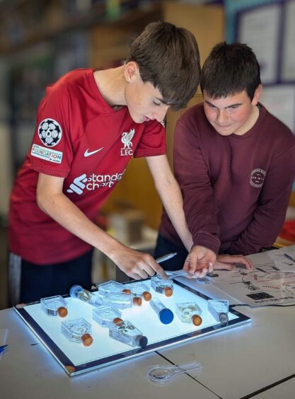 Two Shetland pupils learn more about the science behind animal health