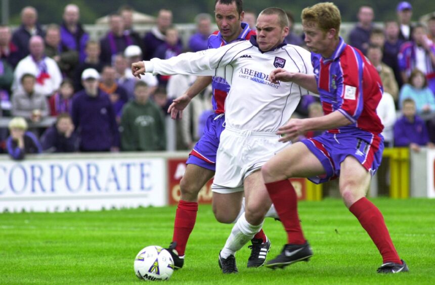 Kenny Gilbert goes on the attack for Ross County, challenged by Caley Thistle's Iain Stewart, left, and Barry Robson in September 16, 2000 - a game County won 1-0 thanks to an Alex Bone goal at the Caledonian Stadium, Inverness. 