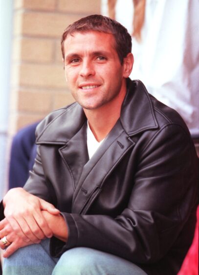 Eric Taborda poses for a picture after arriving for a trial at Aberdeen in 2000.