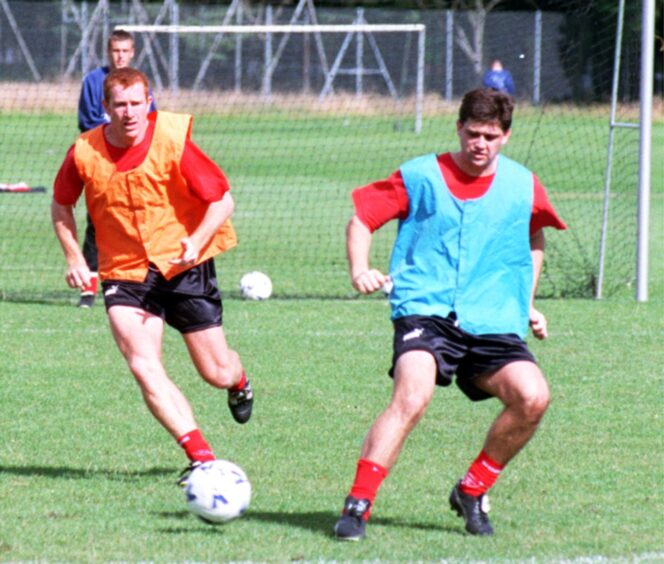 Gavin Wilkinson in training with Aberdeen midfielder Nigel Pepper in 1999.