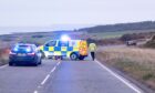 Police at the scene of the crash on the A92 south of Inverbervie.