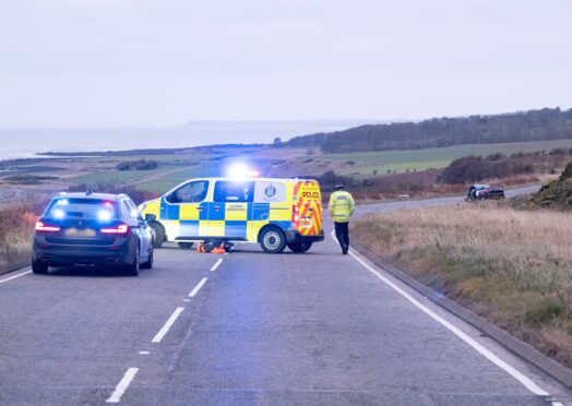 Police at the scene of the crash on the A92 south of Inverbervie.