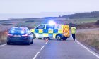 Police at the scene of the crash on the A92 south of Inverbervie.