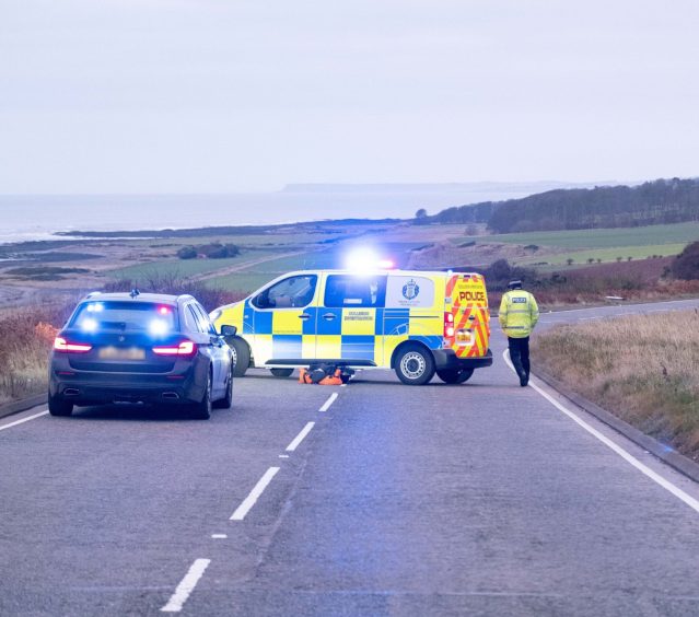 Police at the scene of the crash on the A92 south of Inverbervie.