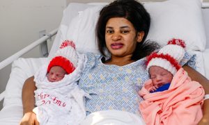 Joy as twins Veny and Karney were born at 4.45am and 4.46am on Christmas Day, the babies are pictured with mum Mercy Simons.