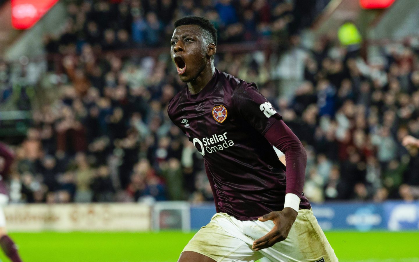 Hearts' Musa Drammeh celebrates the leveller against Aberdeen. Image: SNS 