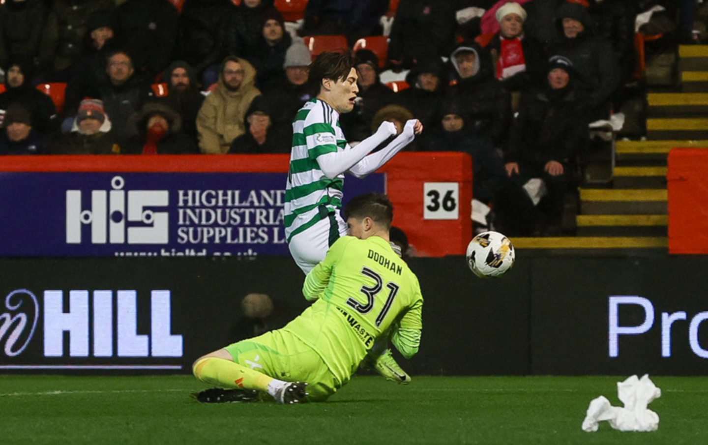 Aberdeen's Ross Doohan collides with Celtic's Kyogo Furuhashi during a 1-0 loss at Pittodrie. Image: SNS 