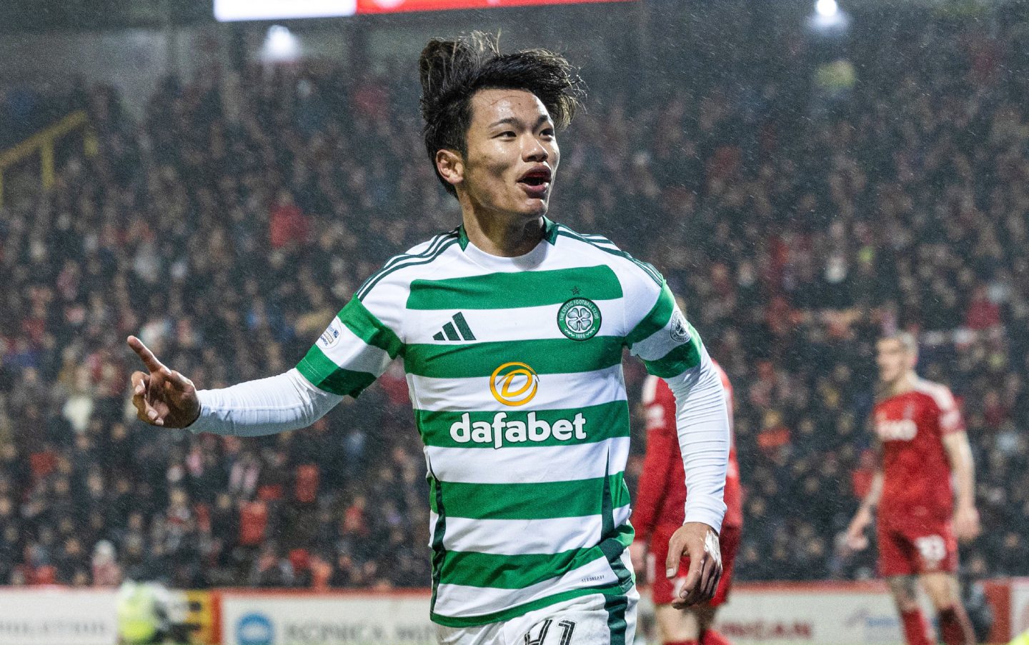 Celtic's Reo Hatate celebrates as he scores to make it 1-0 against Aberdeen at Pittodrie. Image: SNS 