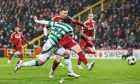 Celtic's Reo Hatate scores to make it 1-0 against Aberdeen at Pittodrie. Image: SNS