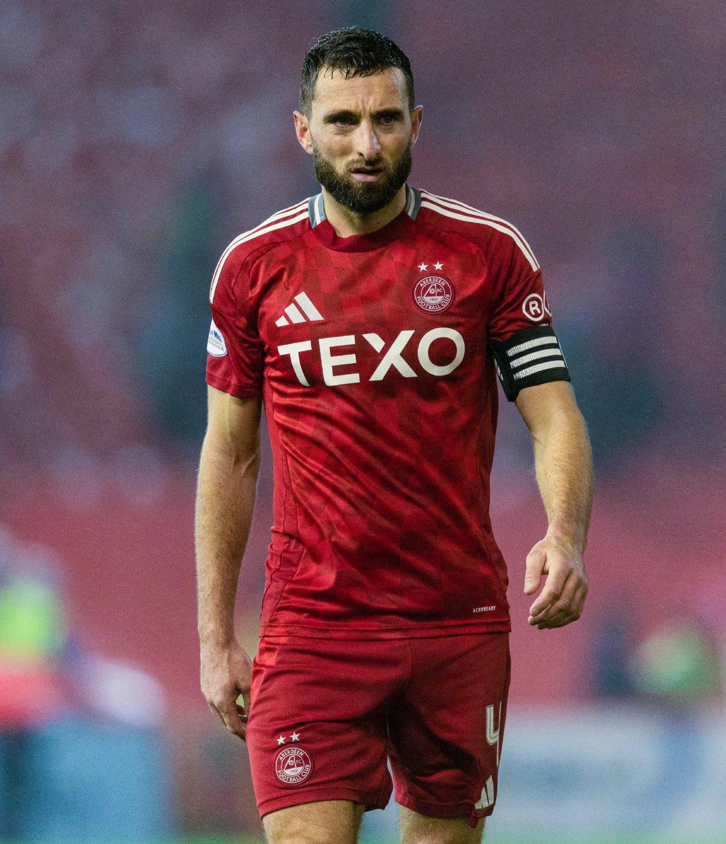 Aberdeen FC captain Graeme Shinnie looks dejected as he leaves the pitch.