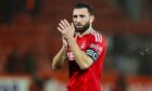 Aberdeen captain Graeme Shinnie applauds the Dons fans following their defeat by Celtic.