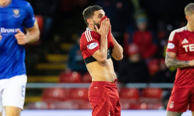 Aberdeen captain Graeme Shinnie looks dejected as St Johnstone's Makenzie Kirk scores to make it 1-0. Image: SNS