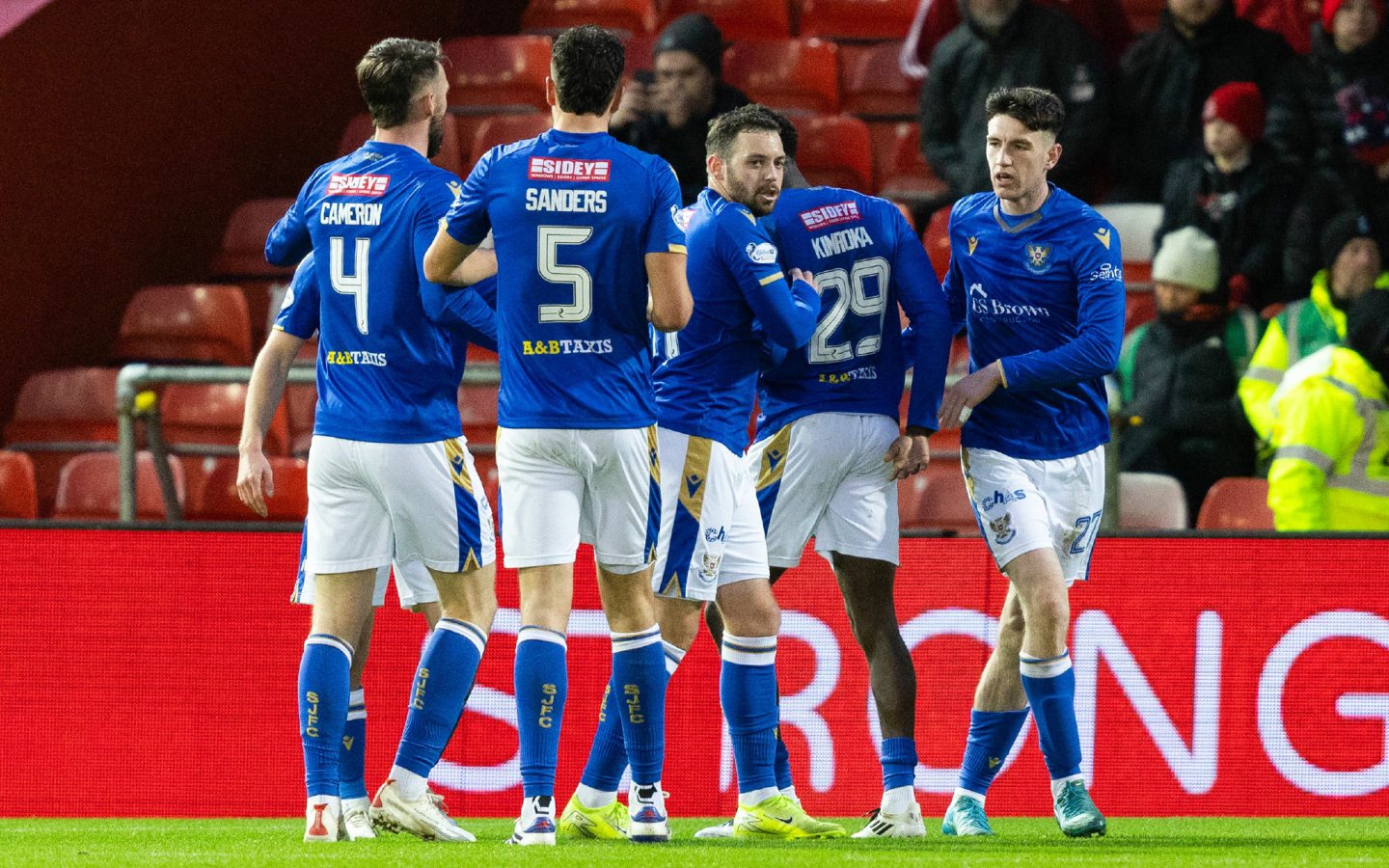 St Johnstone's Makenzie Kirk (R) celebrates scoring to make it 1-0 against Aberdeen with teammates (L-R) Kyle Cameron, Jack Sanders and Drey Wright. Image: SNS 