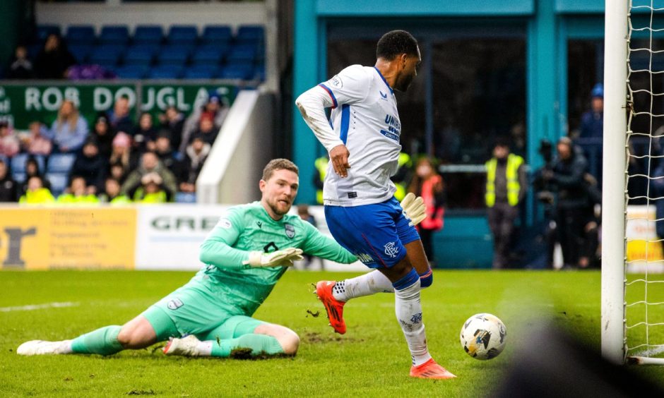 Rangers forward Danilo scores to make it 2-0 after blocking Jack Hamilton's clearance.