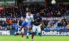 Rangers attacker Hamza Igamane is challenged by Ross County defender Akil Wright.