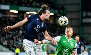 Ross County's James Brown, left, challenges Hibs forward Dwight Gayle for a header in Saturday's 3-1 win for the Hibees at Easter Road.