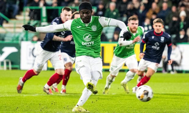 Elie Youan slots away the winning goal from the penalty spot for Hibs against Ross County,