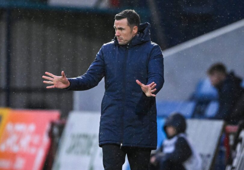 Ross County manager Don Cowie passing on instructions to his team from the sidelines during the St Mirren match.