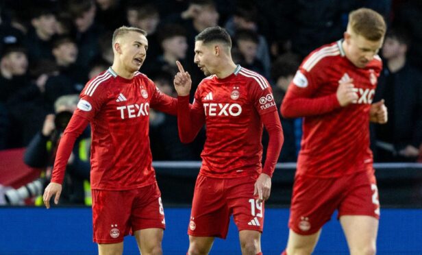 Aberdeen's Topi Keskinen (L) celebrates scoring to make it 1-0 with Ester Sokler against Hibs. Image: SNS