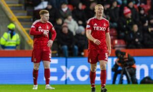 Aberdeen's Sivert Hiltne Nilsen (R) looks dejected during the Premiership match against Hibs.