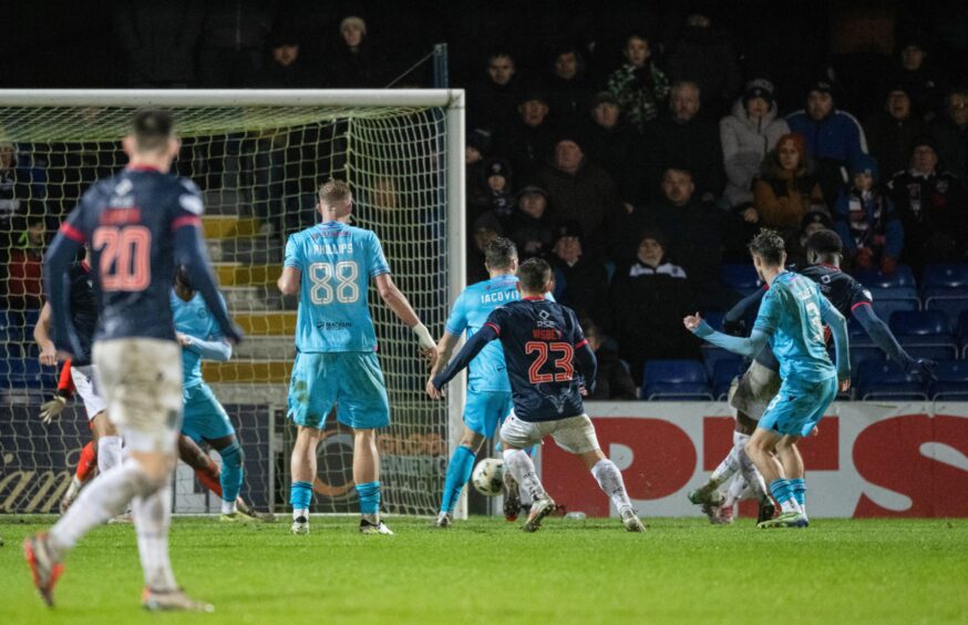 Ross County's Michee Efete scores with a low shot to make it 1-1 against St Mirren. Image: Paul Devlin/SNS.