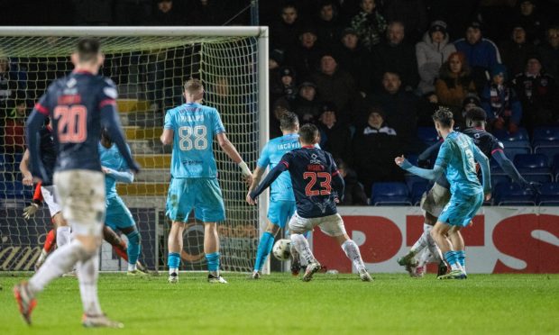 Ross County's Michee Efete steers his shot into the net to make it 1-1 against St Mirren, but it was the Paisley side who walked off with a 2-1 win in Dingwall on Saturday.