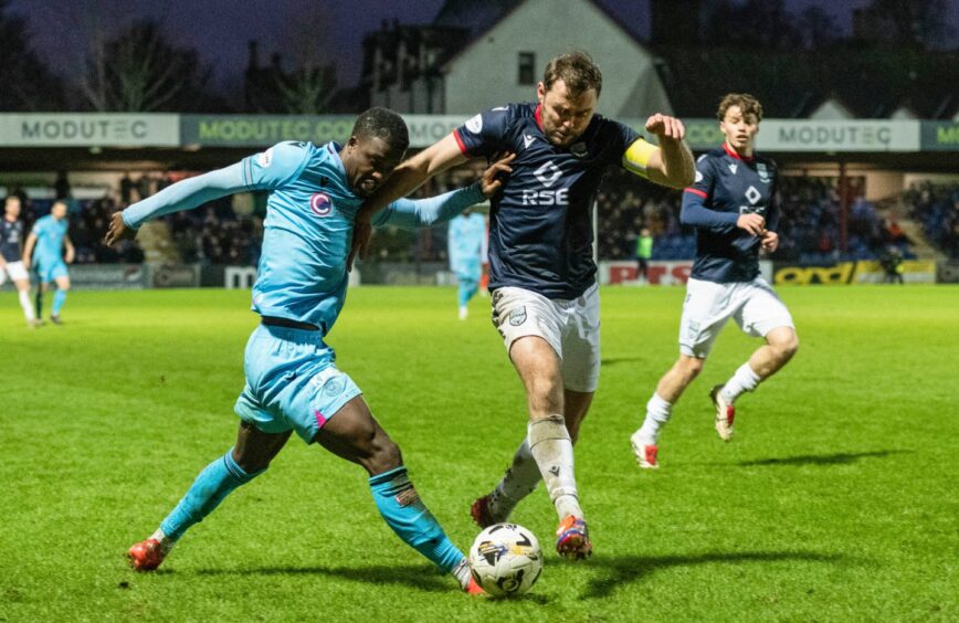 Ross County's Connor Randall, right, challenges St Mirren's Roland Idowu in Saturday's 2-1 win for Saints at the Global Energy Stadium, Dingwall. 