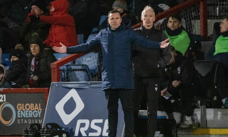 Ross County manager raises his arms by his side in frustration during Saturday's 2-1 defeat by St Mirren at the Global Energy Sradium, Dingwall.