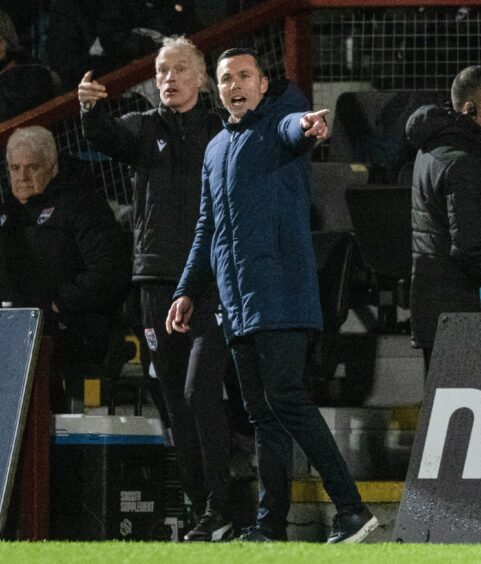 Ross County manager Don Cowie urges his side on from the sidelines in Saturday's 2-1 Premiership defeat against St Mirren. 