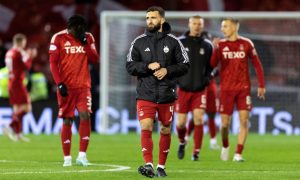 Aberdeen's Graeme Shinnie and his team-mates look dejected at full-time in the 3-1 loss to Hibs. Image: SNS