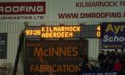 The LED screen shows the score in added time is 4-0 to Kilmarnock.=