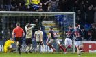 Ross County's Jordan White (centre) celebrates the stunning late leveller against Hearts. Image: Mark Scates/SNS Group.