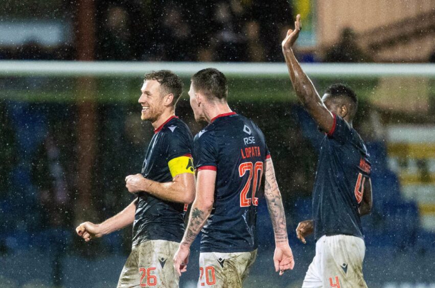 Ross County's Jordan White left)) celebrates at full-time with Kacper Lopata and Akil Wright after the dramatic 2-2 SPFL Premiership draw against Hearts. White's goal followed another stoppage-time County goal from Josh Nisbet at the Global Energy Stadium, Dingwall. 