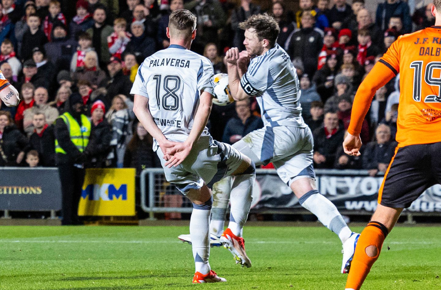 The ball appears to strike Aberdeen's Nicky Devlin's arm leading a penalty being awarded, before being overturned following a VAR check against Dundee United at Tannadice.