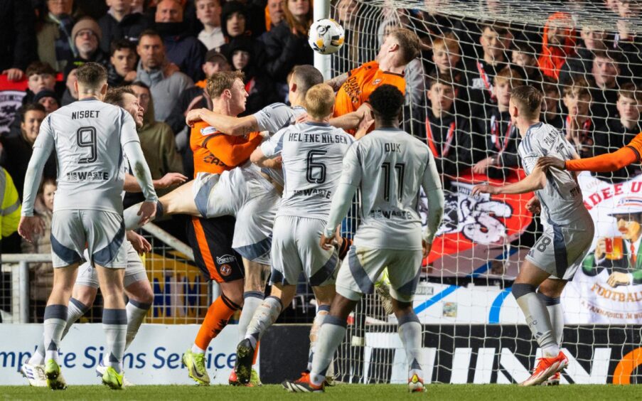 Dundee United's Kevin Holt meets a long throw in to head in the winner from 10 yards to make it 1-0 against Aberdeen at Tannadice.