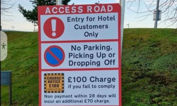 A new red sign has been erected outside the Holiday Inn Express near the city's airport,