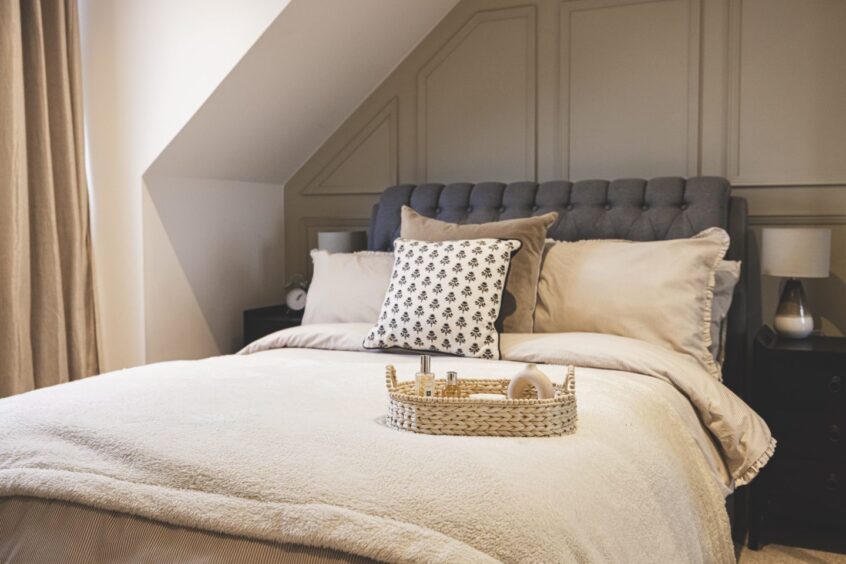 Stylish bedroom in muted shades of cream and beige at this Mannofield property