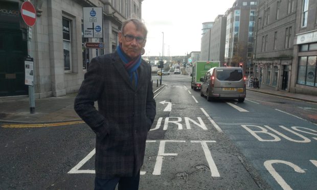 Norman Esslemont on the Market Street bus gate in Aberdeen.