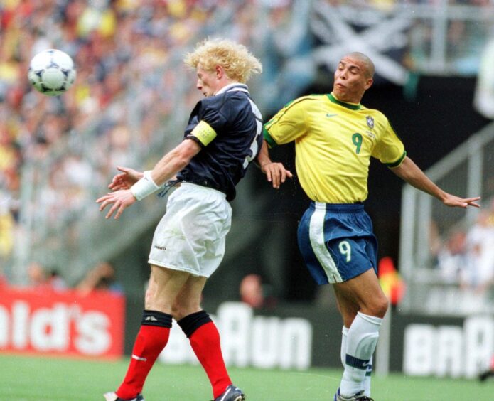 Colin Hendry challenging Brazil star Ronaldo for the ball with a header in the opening fixture of the 1998 World Cup at the Stade de France. The game ended in a 2-1 win for Brazil.