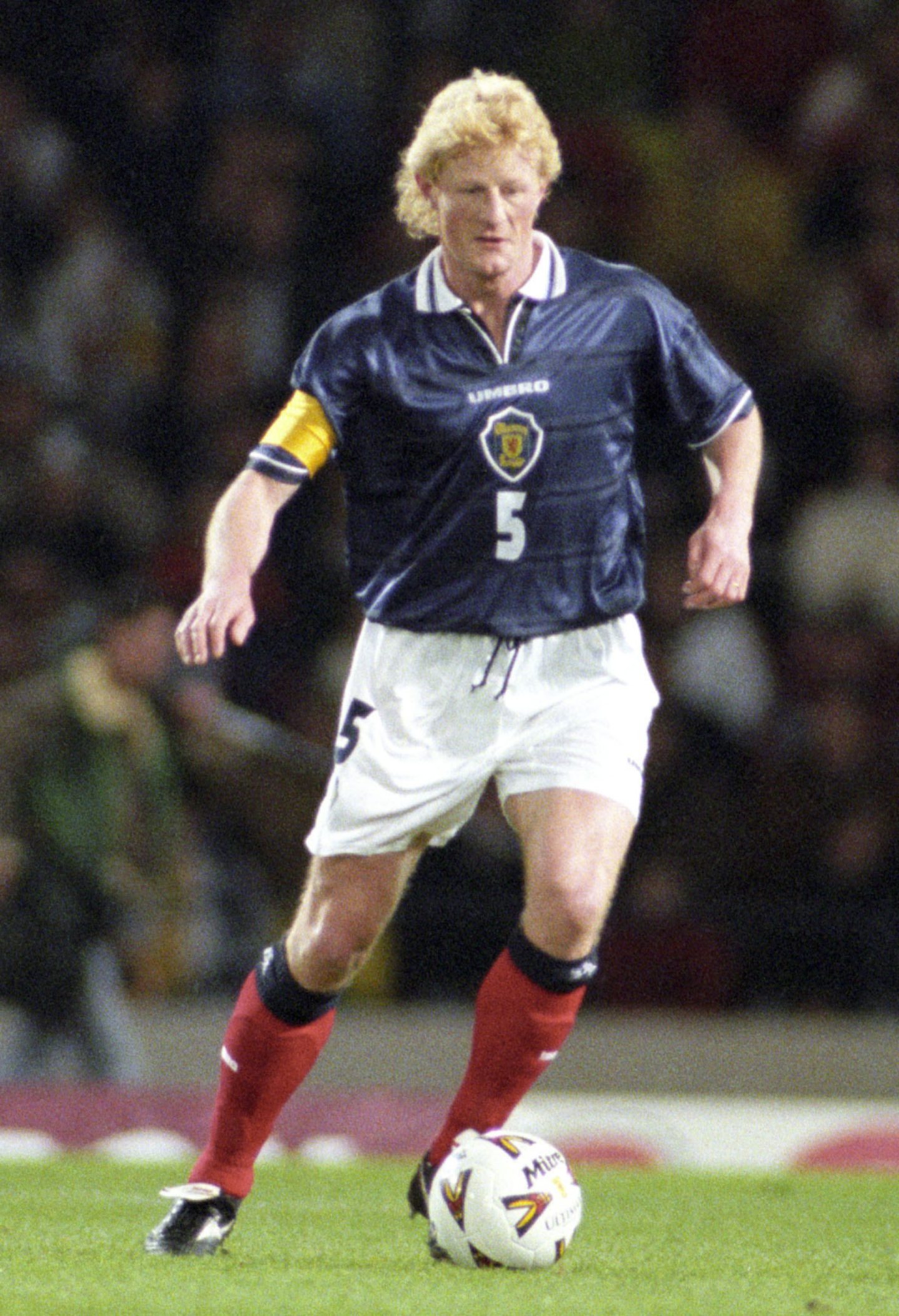 Colin Hendry in action for Scotland in a 2-0 friendly defeat against France at Hampden in 2000. He is seen with the ball at his feet, looking to play a pass. 