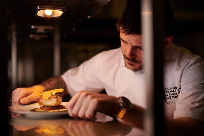 Head chef Alan Clarke preparing a dish. 