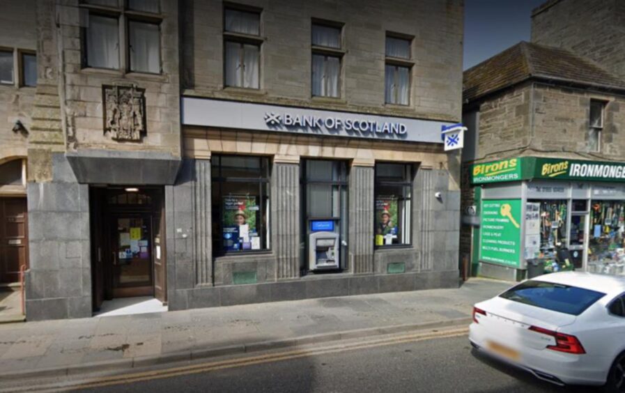 Grey stone facade of the Bank of Scotland in Wick.