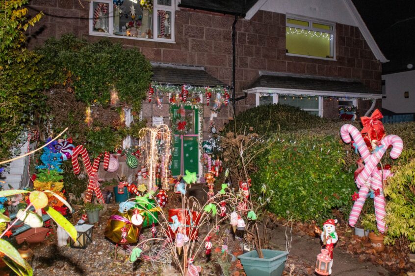 Christmas decorations in front of house