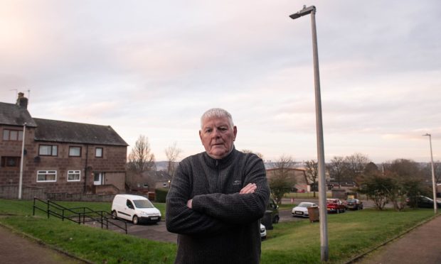 Kincorth resident Adrian Johnston has queried why Aberdeen City Council has taken so long to fix the streetlights. Image: Darrell Benns/DC Thomson