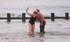 Swimmers take a selfie at Aberdeen beach during the annual Nippy Dip. All images: Darrell Benns/DC Thomson