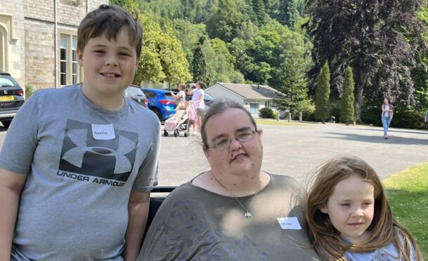 Aberdeen widow Diane Mackie who has died following cancer, shown with her two children.